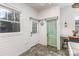 Eat-in kitchen area with built in desk, unique wooden door and lots of natural light at 1824 Umstead St, Charlotte, NC 28205