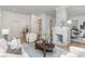 Bright living room showcasing hardwood floors, a modern fireplace, and opening to a dining area at 1824 Umstead St, Charlotte, NC 28205