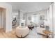 Bright living room features hardwood floors, a decorative fireplace, and ample seating with lots of natural light at 1824 Umstead St, Charlotte, NC 28205
