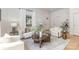 Cozy living room featuring hardwood floors, neutral furniture, lots of natural light and stylish decor at 1824 Umstead St, Charlotte, NC 28205
