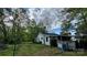Expansive backyard featuring a well-maintained lawn, a shed, a fence, and mature trees at 2118 Polkville Rd, Shelby, NC 28150