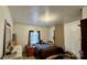 Bright bedroom with a dresser with mirror, window with curtains, and neatly made bed at 2118 Polkville Rd, Shelby, NC 28150