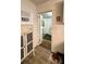 View into the kitchen shows classic decor and a glimpse into the mudroom at 2118 Polkville Rd, Shelby, NC 28150