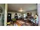 Cozy living room featuring hardwood floors, a fireplace, comfortable seating, and natural light streaming through the windows at 2118 Polkville Rd, Shelby, NC 28150
