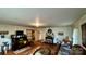 Open living room boasts hardwood floors, a fireplace, and ample seating at 2118 Polkville Rd, Shelby, NC 28150