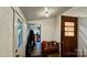 Mudroom with a wooden bench, a door leading outside, and a glimpse into the kitchen at 2118 Polkville Rd, Shelby, NC 28150