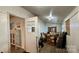 Spacious mudroom filled with cardboard boxes and a view into the kitchen at 2118 Polkville Rd, Shelby, NC 28150