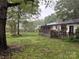 Expansive backyard with a wooden deck, perfect for outdoor dining and enjoying the scenery at 212 E Stewart Ave, Mooresville, NC 28115