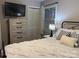 Comfortable bedroom featuring a TV, and a serene, inviting decor at 212 E Stewart Ave, Mooresville, NC 28115