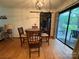 Dining room showcasing hardwood floors and sliding glass doors at 212 E Stewart Ave, Mooresville, NC 28115