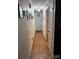 Bright hallway features hardwood floors and leads to various rooms at 212 E Stewart Ave, Mooresville, NC 28115