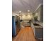 Modern kitchen with stainless steel appliances, granite countertops, and hardwood floors at 212 E Stewart Ave, Mooresville, NC 28115