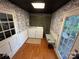 Well-lit laundry room with washer, dryer, ample storage, and bench seating at 212 E Stewart Ave, Mooresville, NC 28115