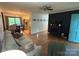 Comfortable living room with a charming fireplace, hardwood floors, and an adjacent dining area at 212 E Stewart Ave, Mooresville, NC 28115