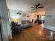 Bright living room featuring hardwood floors and a ceiling fan at 212 E Stewart Ave, Mooresville, NC 28115