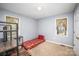 Bedroom with neutral carpet and a single bed is illuminated by natural light from two windows at 215 Raleigh Nw St, Concord, NC 28027