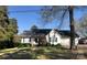 Charming home featuring a well-manicured lawn, covered porch, and attached two-car garage at 215 Raleigh Nw St, Concord, NC 28027