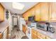 Well-equipped kitchen with wooden cabinets, appliances, and efficient layout at 215 Raleigh Nw St, Concord, NC 28027