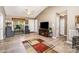 Open-concept living area with wood-look flooring, seating, and ample natural light at 215 Raleigh Nw St, Concord, NC 28027