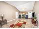 Bright living room with vaulted ceiling, ceiling fan, and wood-look floors at 215 Raleigh Nw St, Concord, NC 28027