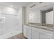 Modern bathroom featuring a double granite vanity and glass enclosed shower at 221 Century Dr, Salisbury, NC 28147