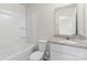 Clean bathroom featuring a granite vanity, tub-shower combo, and modern fixtures at 221 Century Dr, Salisbury, NC 28147