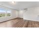 Bright living room featuring sleek flooring, an entrance, and a staircase at 221 Century Dr, Salisbury, NC 28147