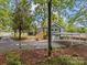 Home exterior with wooden deck and basement and view of a carport at 2222 Moose Rd, Kannapolis, NC 28083