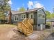 Home exterior with a wooden deck and a basement at 2222 Moose Rd, Kannapolis, NC 28083