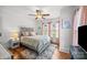 Charming bedroom with natural light, hardwood floors, and elegant decor at 2222 Moose Rd, Kannapolis, NC 28083