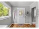 Welcoming entryway featuring a windowed front door, natural light, and stylish decor at 2222 Moose Rd, Kannapolis, NC 28083