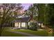 Charming craftsman home with inviting front porch, natural wood accents, and lush landscaping at 2222 Moose Rd, Kannapolis, NC 28083