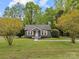 Charming bungalow with inviting front porch and well-manicured front yard at 2222 Moose Rd, Kannapolis, NC 28083