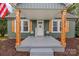 Charming front porch with wooden posts, shutters, and a 'Welcome' sign for a cozy entrance at 2222 Moose Rd, Kannapolis, NC 28083