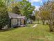 Charming home features a well-maintained lawn, inviting porch, and a welcoming atmosphere at 2222 Moose Rd, Kannapolis, NC 28083