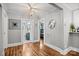 Hallway with hardwood floors leading to a bathroom and bedroom with open floor plan at 2222 Moose Rd, Kannapolis, NC 28083