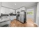 Modern kitchen features stainless steel appliances, granite countertops and white cabinetry at 2222 Moose Rd, Kannapolis, NC 28083
