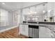 Bright eat-in kitchen with granite countertops, stainless appliances, and hardwood floors at 2222 Moose Rd, Kannapolis, NC 28083