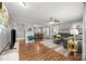 Spacious living room with hardwood floors, modern furniture, ceiling fan, and natural light at 2222 Moose Rd, Kannapolis, NC 28083