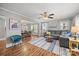 Bright living room with hardwood floors, comfortable seating, and an open view to dining area at 2222 Moose Rd, Kannapolis, NC 28083
