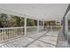 Spacious back porch with white railing offers a serene outdoor space for relaxation and entertaining at 2403 Mary Ave, Gastonia, NC 28052