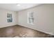 This bedroom features hardwood floors and two windows for natural light at 2403 Mary Ave, Gastonia, NC 28052