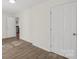 This hallway features hardwood floors and white trim at 2403 Mary Ave, Gastonia, NC 28052