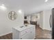 Bright kitchen with quartz island and view of the living and dining area at 2403 Mary Ave, Gastonia, NC 28052