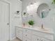 Bright bathroom featuring double sinks, decorative mirrors, and ample cabinet space at 2856 Huckleberry Hill Dr, Fort Mill, SC 29715