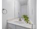 Clean half bathroom with a white vanity, modern faucet, and decorative plant at 2856 Huckleberry Hill Dr, Fort Mill, SC 29715