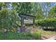 Sign for the Sunningdale community, surrounded by lush greenery at 2856 Huckleberry Hill Dr, Fort Mill, SC 29715