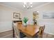 Charming dining room features wood-look floors, white wainscoting, and ample natural light at 2856 Huckleberry Hill Dr, Fort Mill, SC 29715