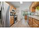 Well-lit kitchen with wood cabinets, stainless steel appliances, and modern countertops at 2856 Huckleberry Hill Dr, Fort Mill, SC 29715