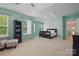 Bright main bedroom boasts a tray ceiling, carpeted floors, and large windows at 2856 Huckleberry Hill Dr, Fort Mill, SC 29715